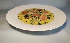 Cheese soup with potatoes, noodles and sausages