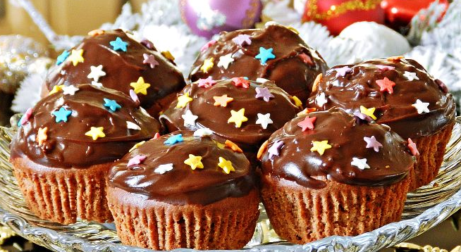 Chocolate cupcakes with cherry jam and nuts