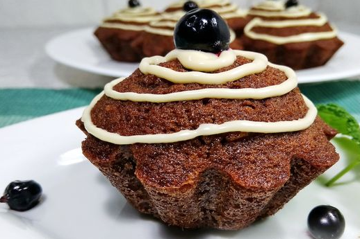 Chocolate cupcakes with blackcurrant and orange