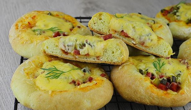 Cottage cheese mini pizzas with sausage and pickled cucumbers
