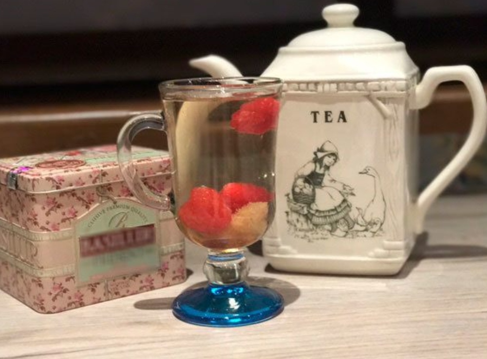White herbal tea with raspberries