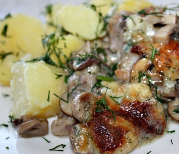 Pork with mushrooms baked in a creamy sauce