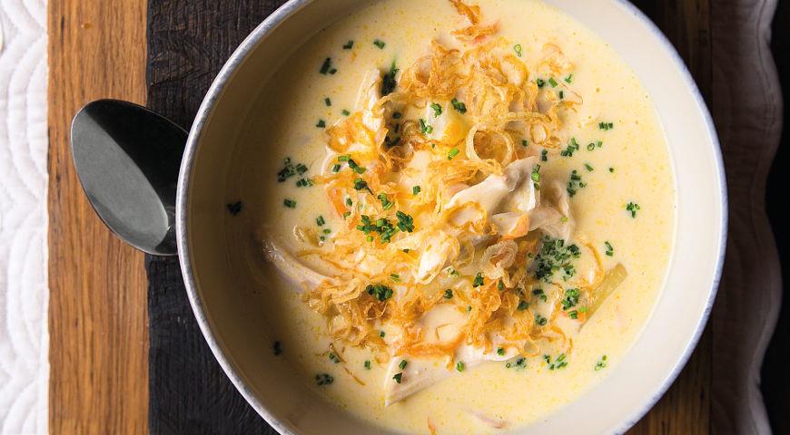 Chicken soup with melted cheese