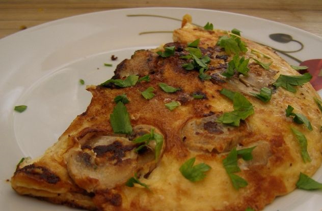 Omelet with mushrooms stewed in cream