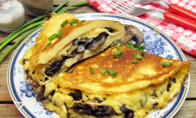 Omelet stuffed with mushrooms, beans and cheese