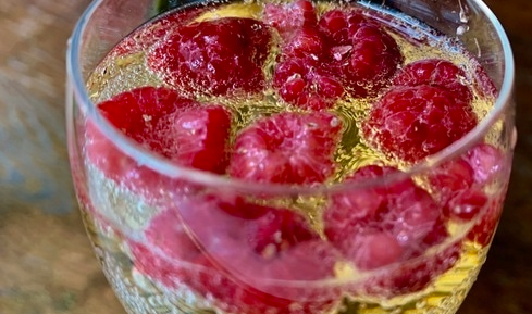 Champagne with raspberries