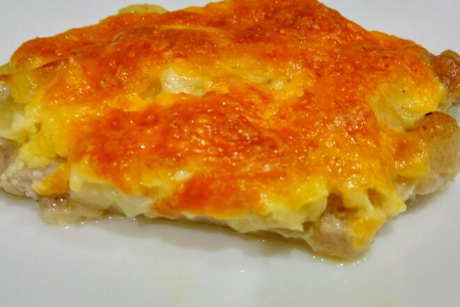 French Meat With Onions And Cheese In The Oven