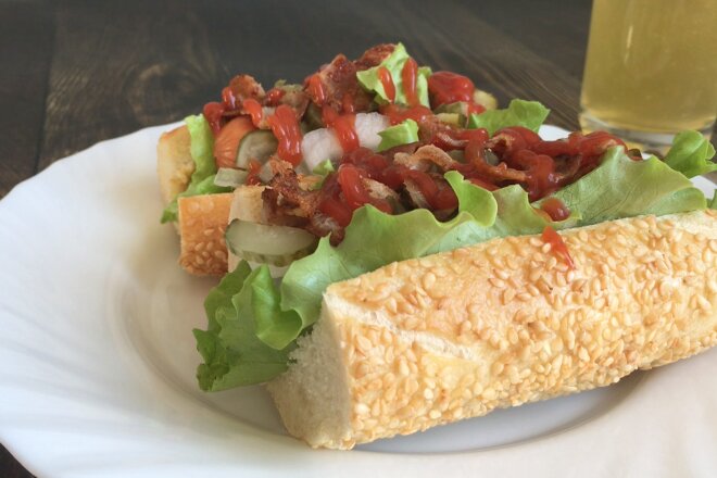 Hot Dog With Bacon In A Baguette