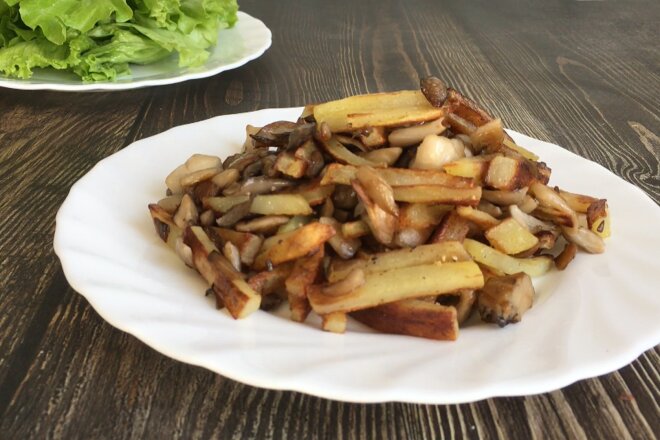 Fried Potatoes With Oyster Mushrooms In A Pan