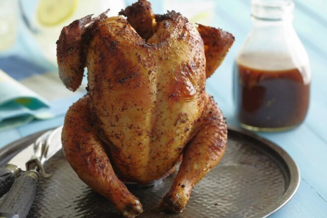 Chicken With Garlic On A Jar Of Water