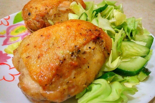 Fried Chicken Legs In A Pan With Garlic