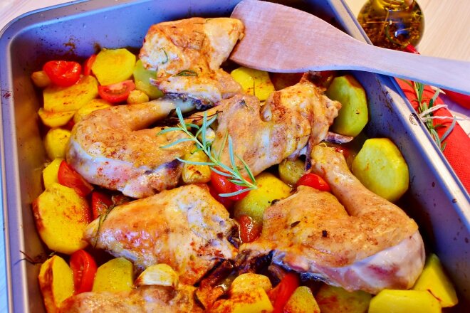 Baked Chicken Thighs With Potatoes, Cherry Tomatoes And Garlic