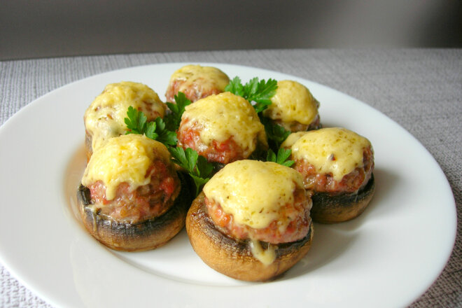 Mushrooms Stuffed With Meat And Cheese In The Oven